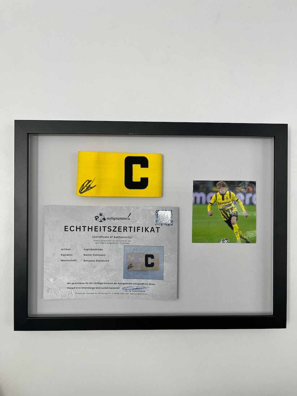 Captain's armband signed by Daniel Svensson as part of the Borussia Dortmund COA