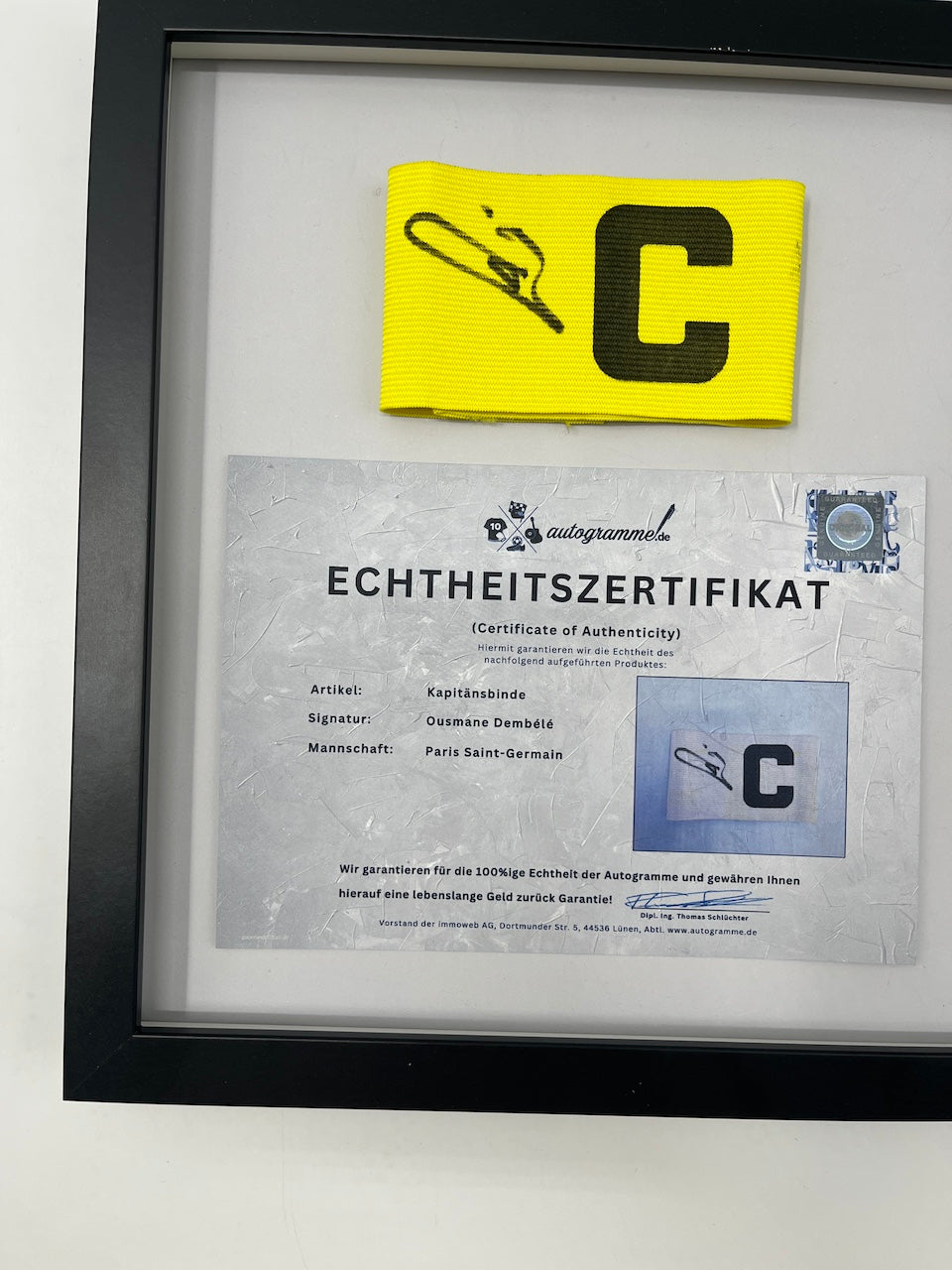 Captain's armband signed by Ousmane Dembele in a PSG COA frame