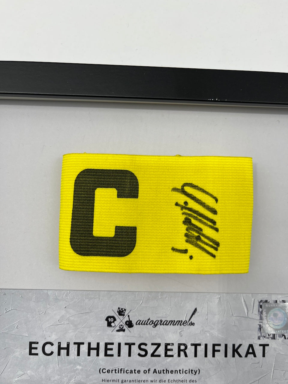 Captain's armband signed by Lothar Matthäus in a frame Germany COA