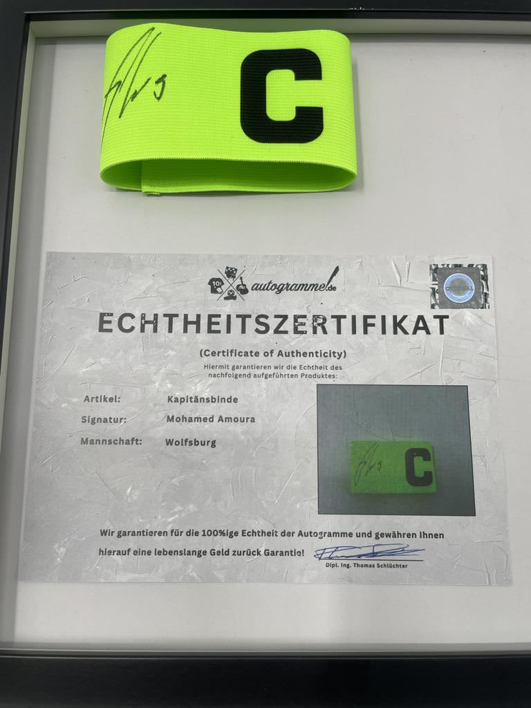 Captain's armband signed by Mohamed Amoura in a Wolfsburg frame, autograph COA
