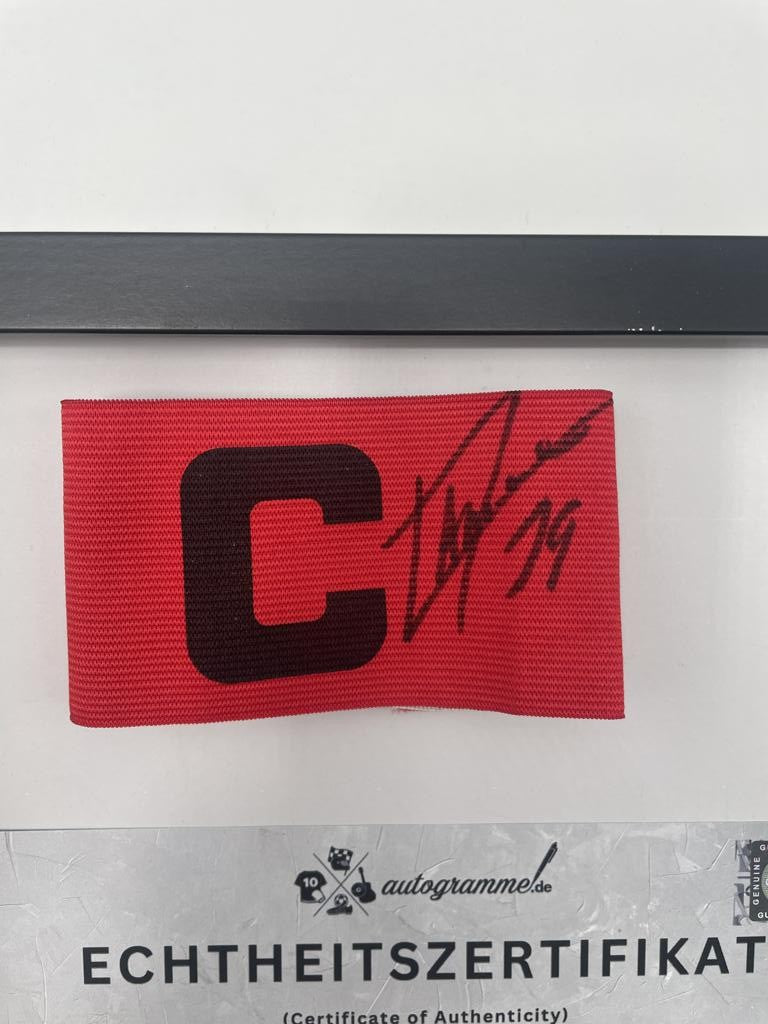 Captain's armband signed by Lamine Yamal in a framed FC Barcelona COA autograph