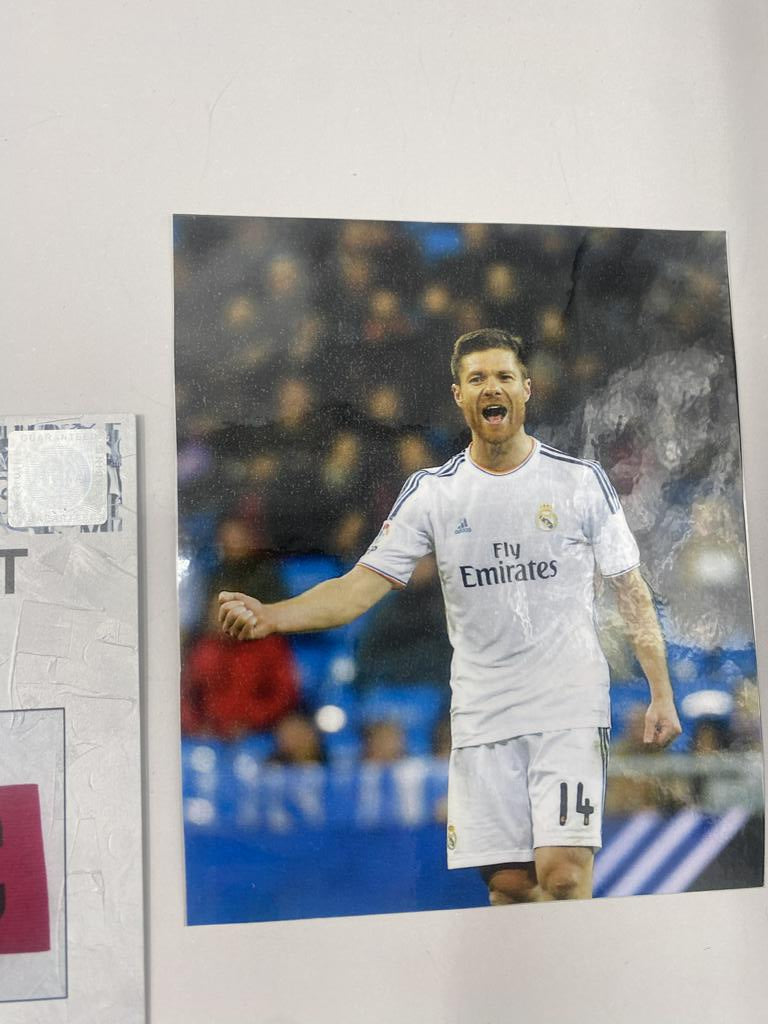 Captain's armband signed by Xabi Alonso in a Real Madrid football COA autograph frame