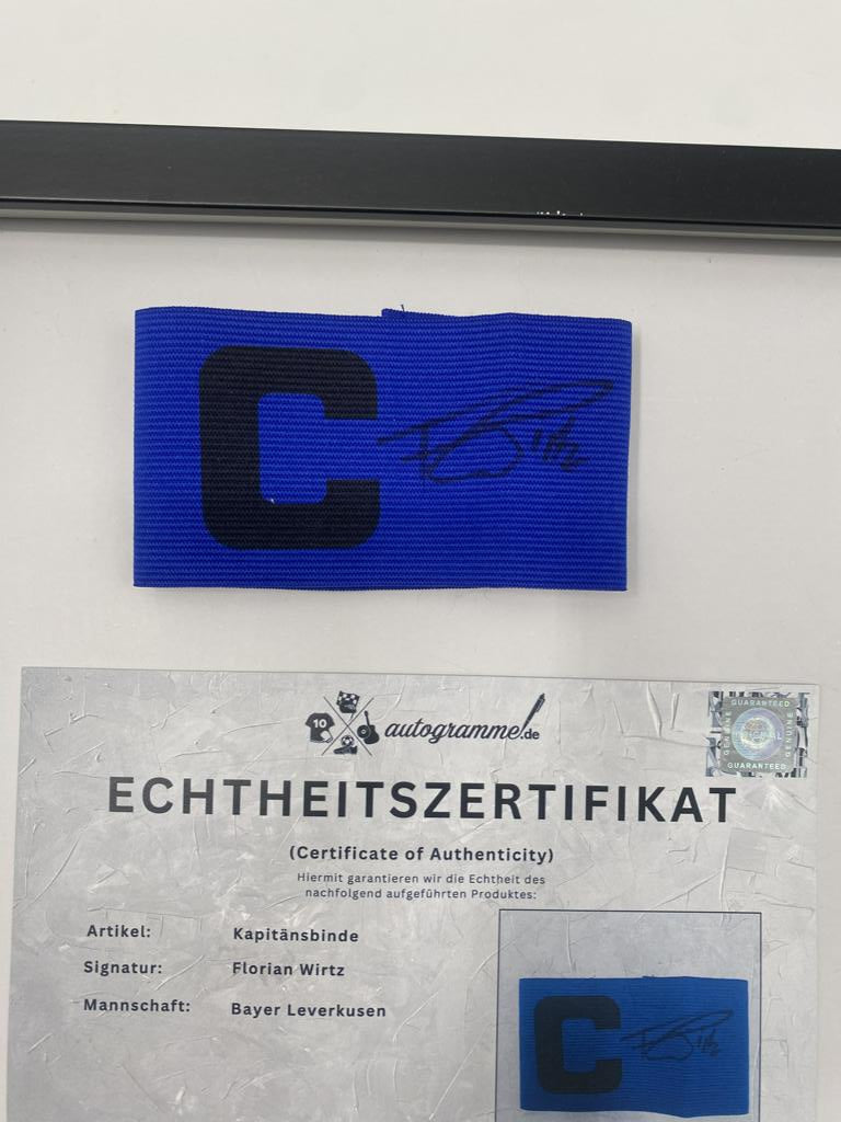 Captain's armband signed by Florian Wirtz in a Bayer Leverkusen autograph frame