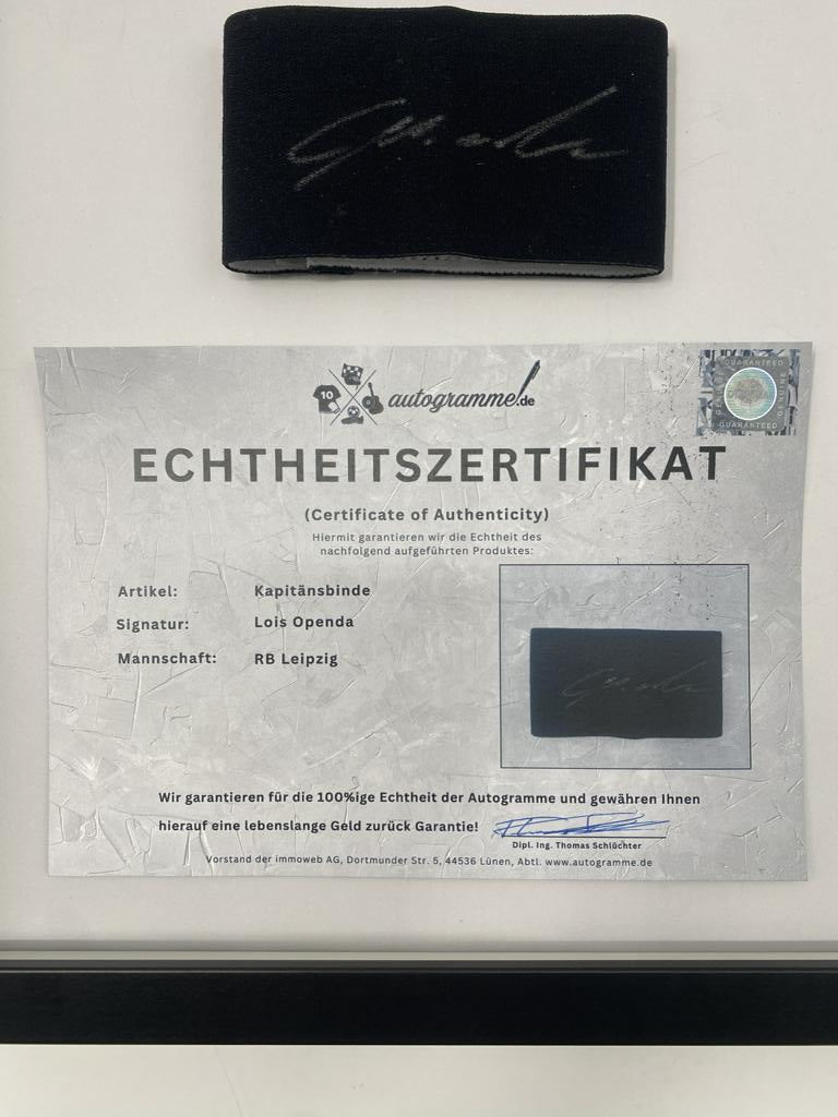 Captain's armband signed by Lois Openda in a framed RB Leipzig autograph