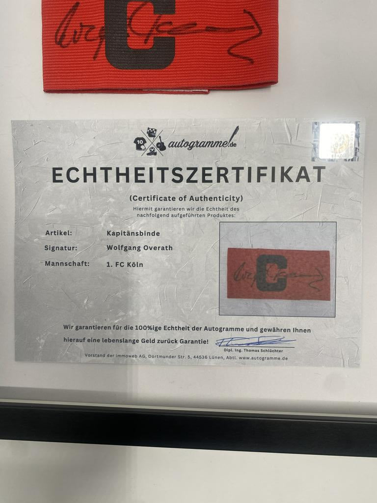 Captain's armband Wolfgang Overath signs in a frame 1. FC Köln autograph