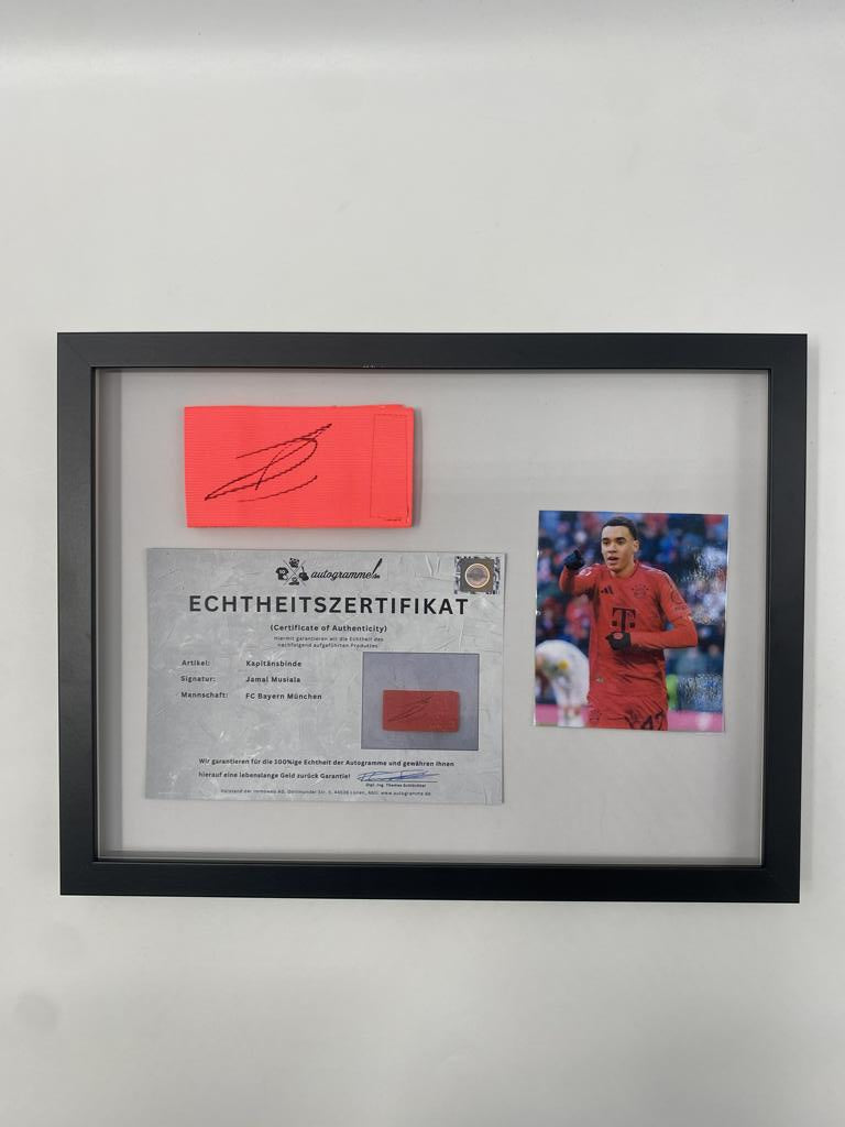 Captain's armband signed by Jamal Musiala in a Bayern Munich football autograph frame