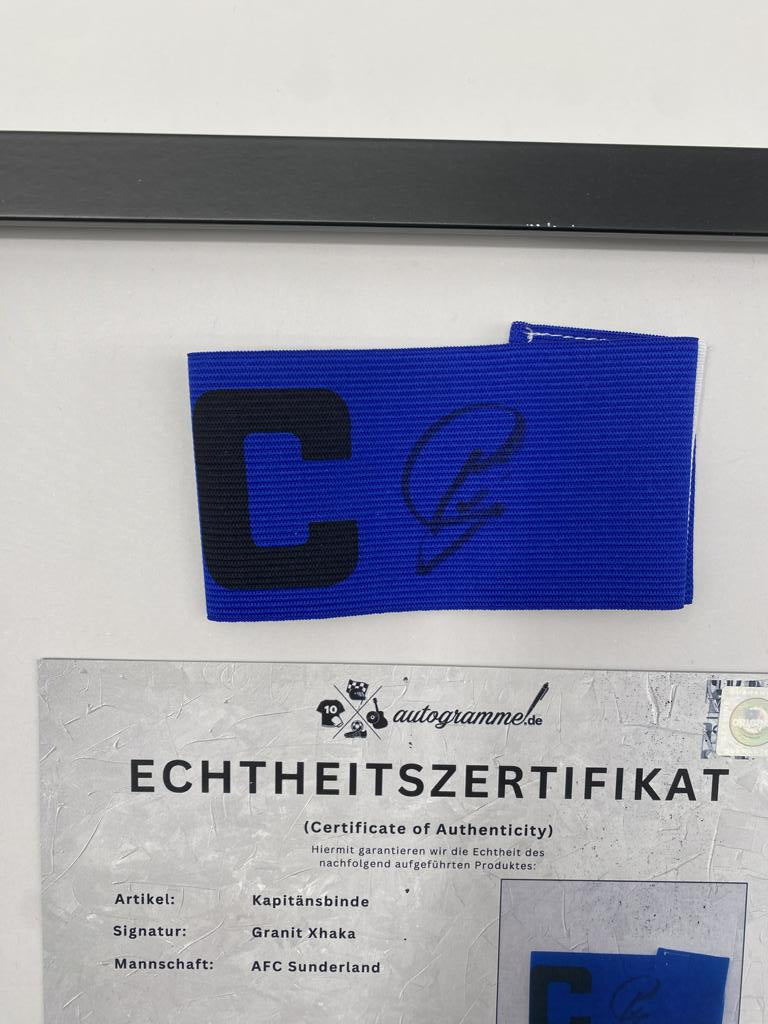 Captain's armband signed by Granit Xhaka in a frame, AFC Sunderland autograph