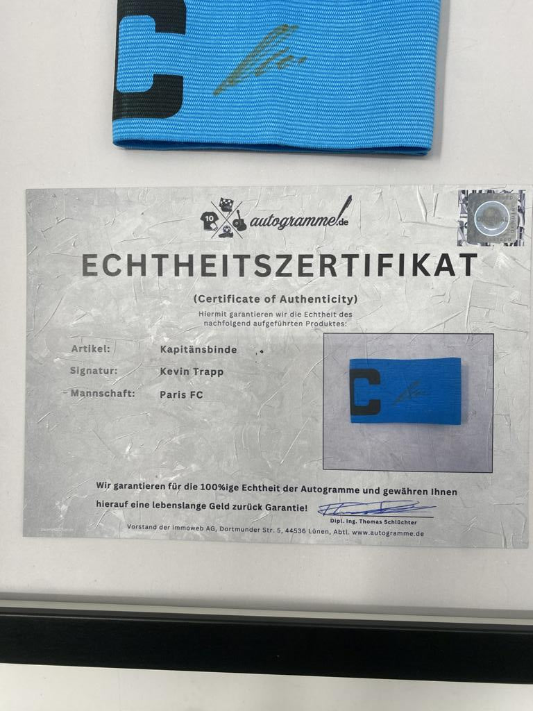 Captain's armband signed by Kevin Trapp in a Paris FC autograph COA frame