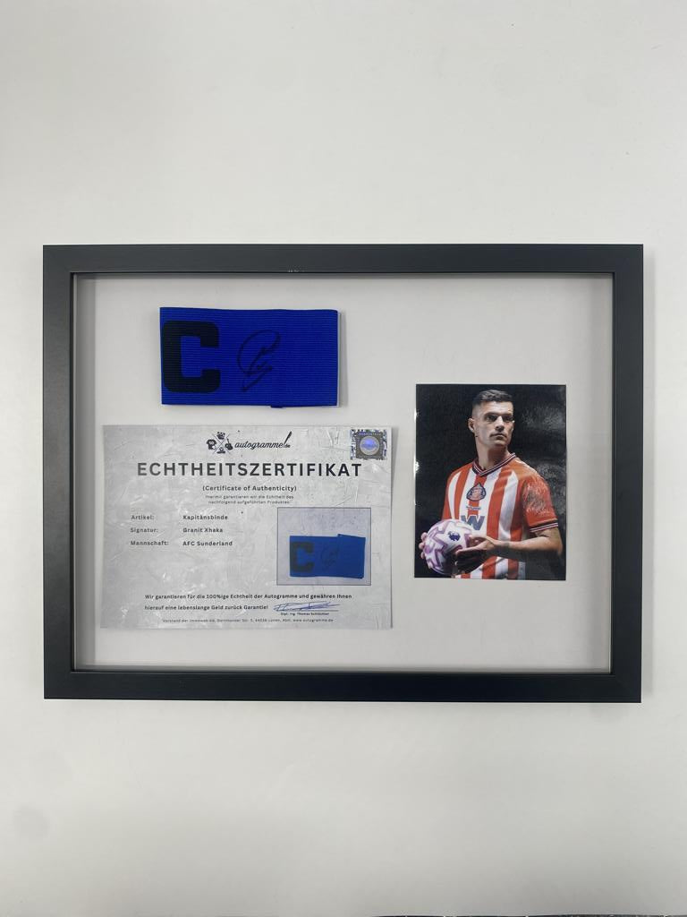 Captain's armband signed by Granit Xhaka in a frame, AFC Sunderland autograph