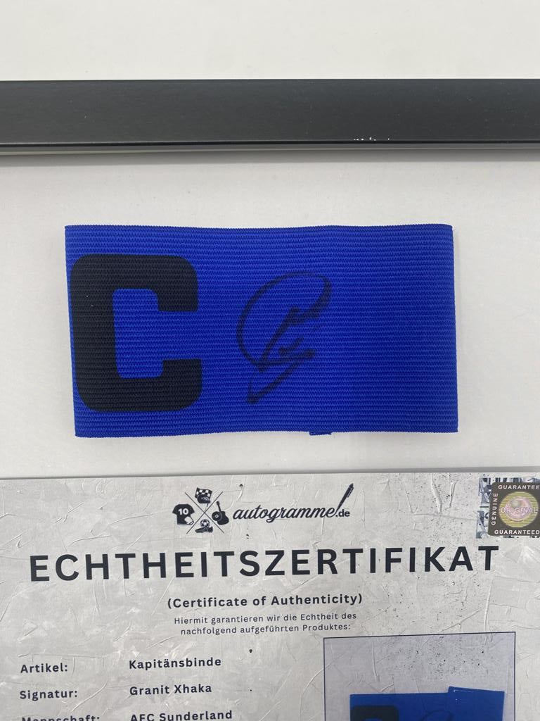 Captain's armband signed by Granit Xhaka in a frame, AFC Sunderland autograph