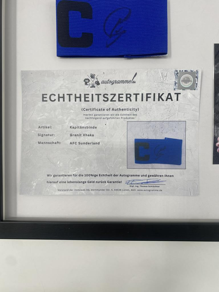 Captain's armband signed by Granit Xhaka in a frame, AFC Sunderland autograph
