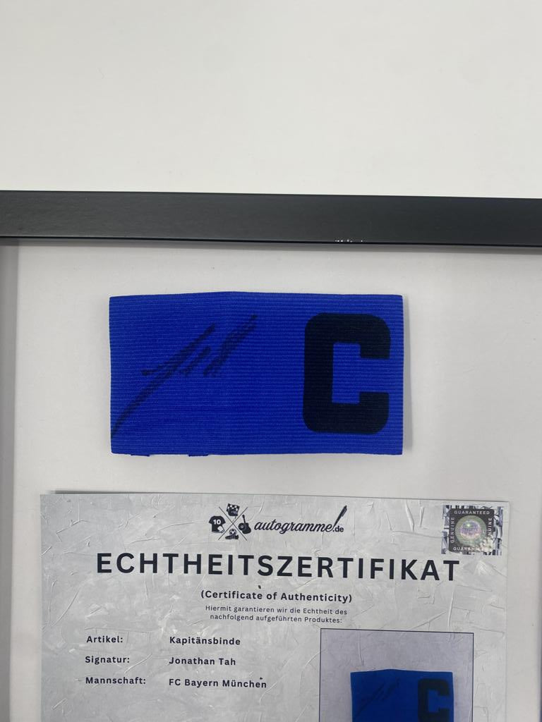 Captain's armband signed by Jonathan Tah in a Bayern Munich football autograph frame