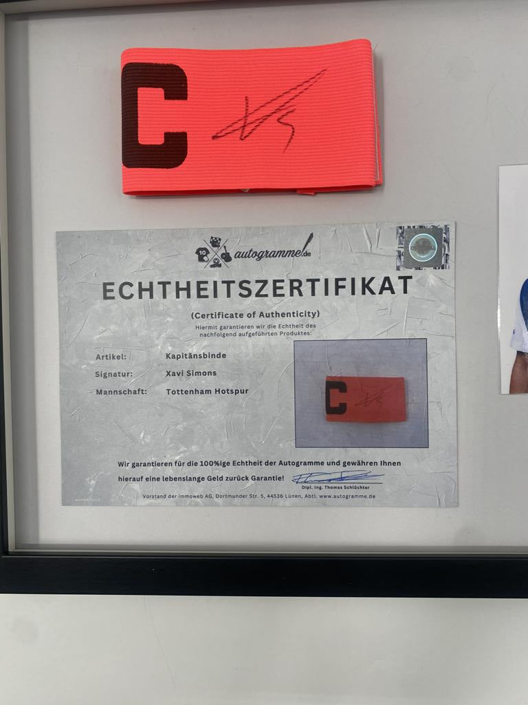 Captain's armband signed by Xavi Simons in a frame, Tottenham Hotspur