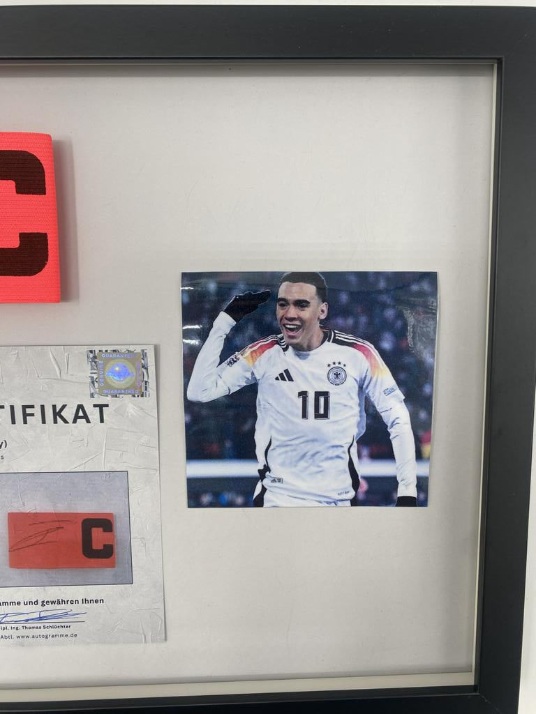 Captain's armband signed by Jamal Musiala in a Bayern Munich football autograph frame