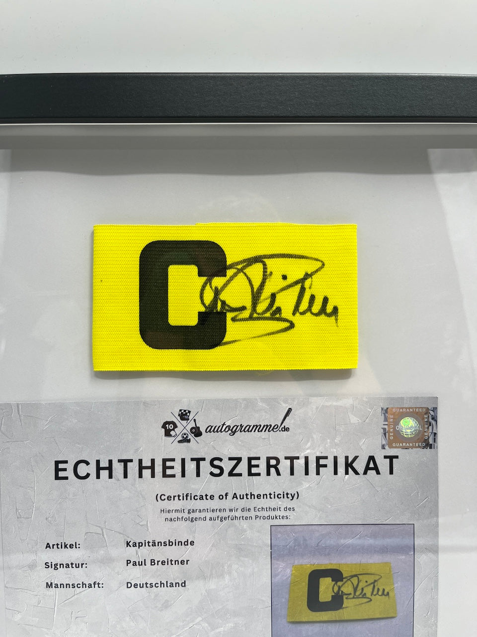 Captain's armband signed by Paul Breitner in a DFB football autograph COA frame