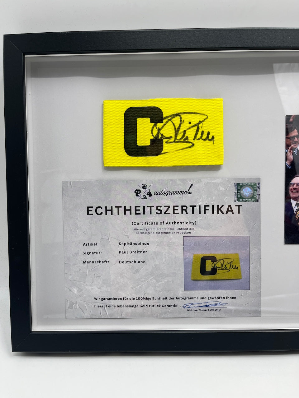 Captain's armband signed by Paul Breitner in a DFB football autograph COA frame