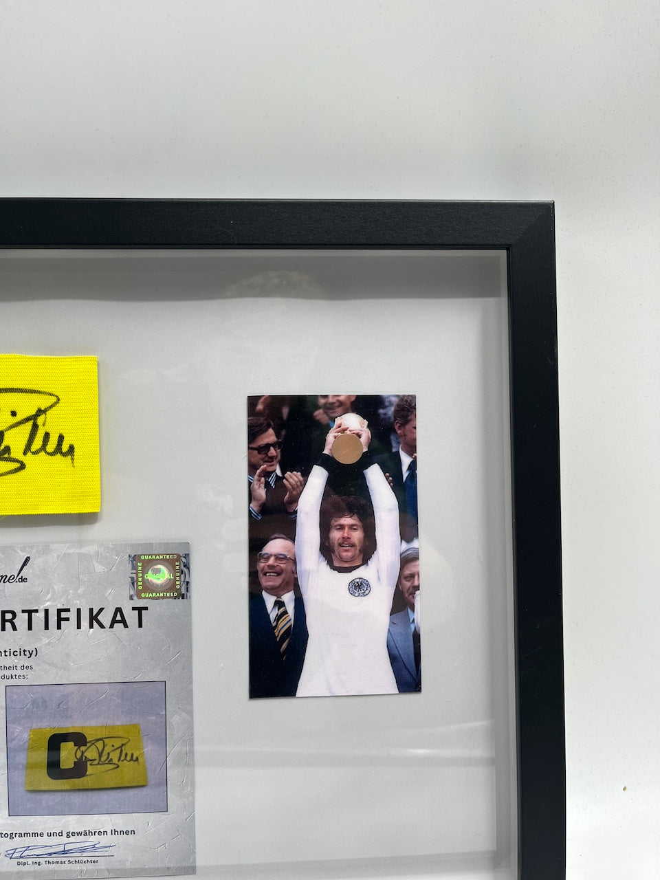 Captain's armband signed by Paul Breitner in a DFB football autograph COA frame
