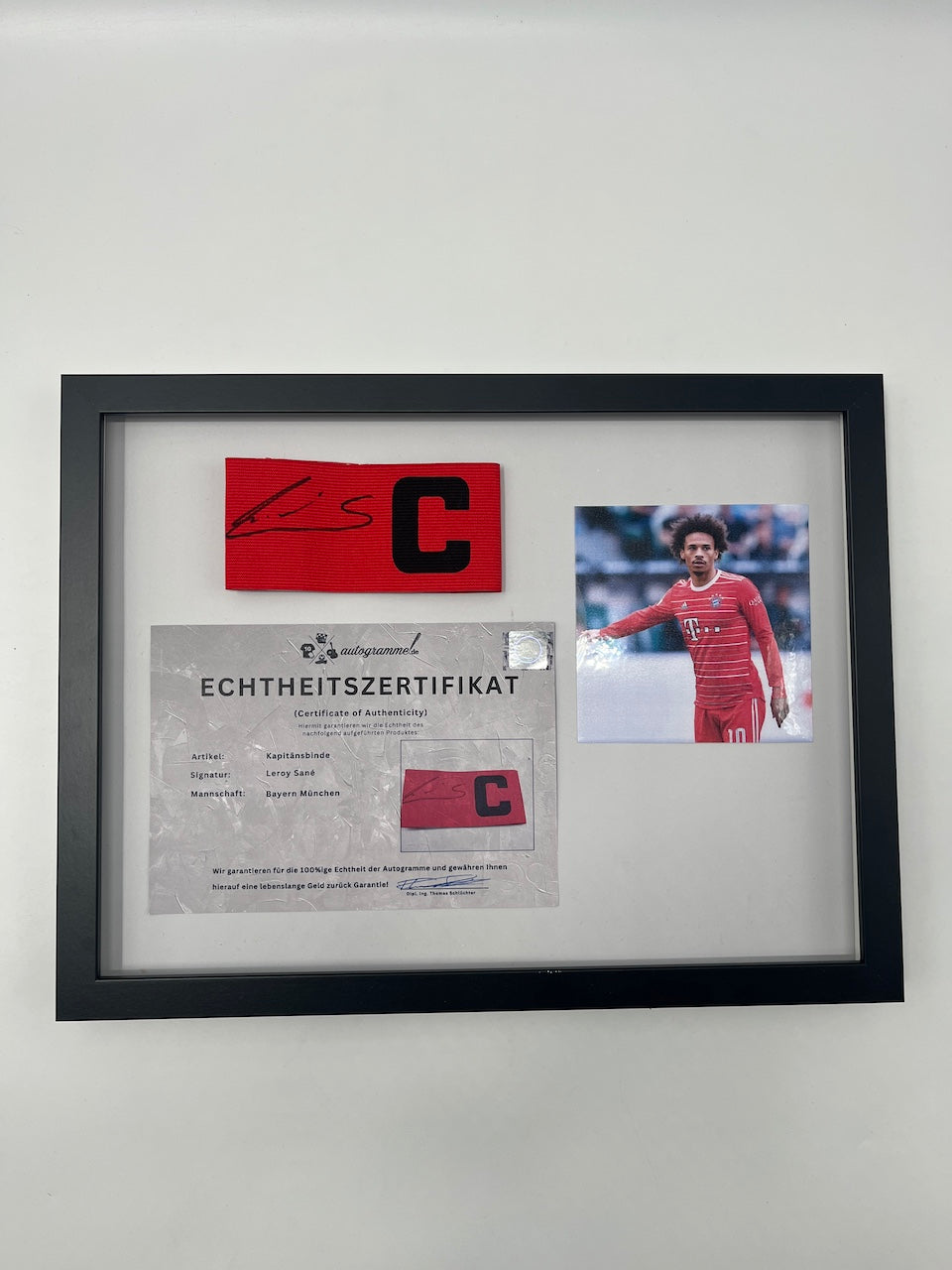 Captain's armband signed by Leroy Sane in a Bayern Munich autograph COA frame