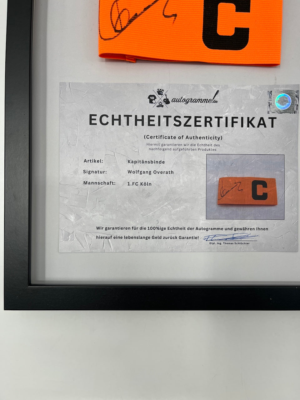 Kapitänsbinde Wolfgang Overath signiert im Rahmen Köln COA Autogramm