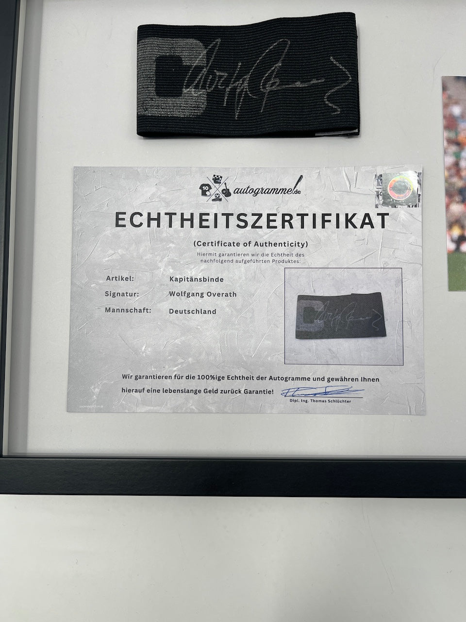 Captain's armband signed by Wolfgang Overath in a frame, Cologne Autograph