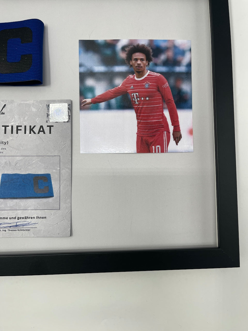 Captain's armband signed by Leroy Sane in a Bayern Munich autograph frame