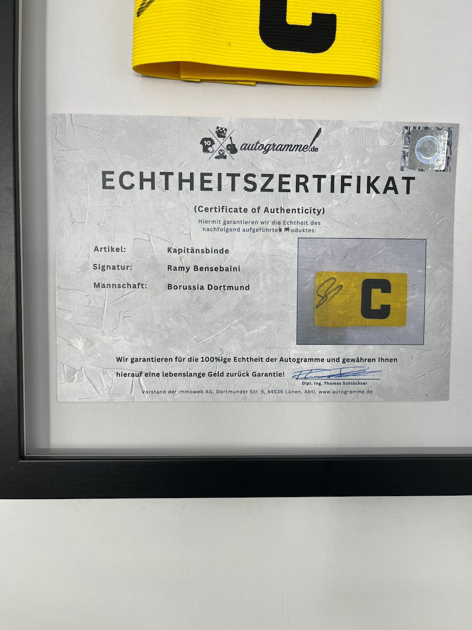 Captain's armband signed by Ramy Bensebaini in a Borussia Dortmund COA frame