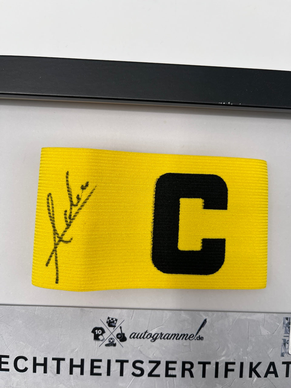 Captain's armband signed by Waldemar Anton in a Borussia Dortmund COA frame