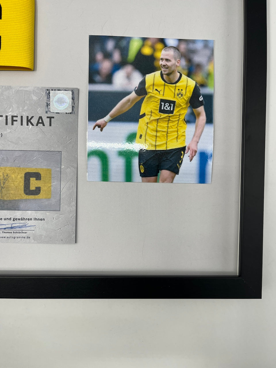 Captain's armband signed by Waldemar Anton in a Borussia Dortmund COA frame