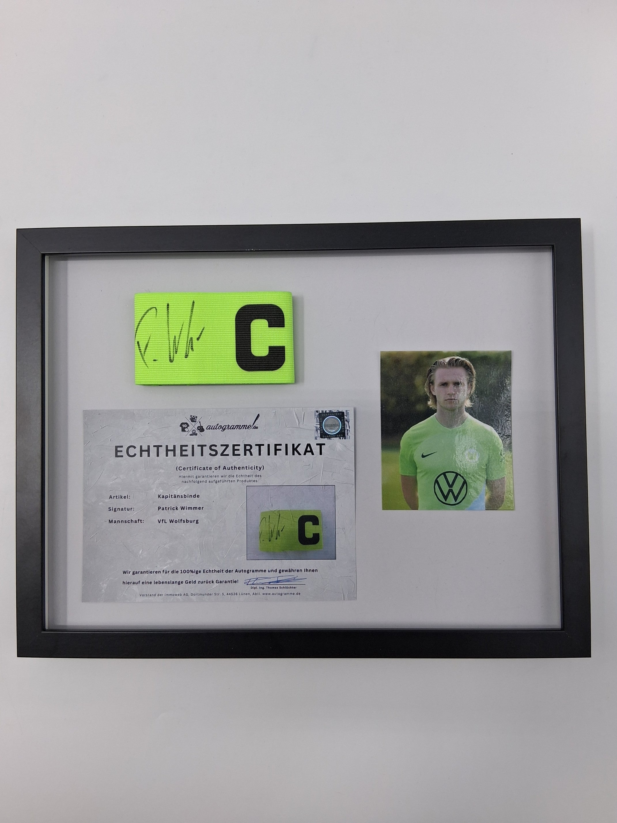Captain's armband signed by Patrick Wimmer in a VFL Wolfsburg autograph COA frame