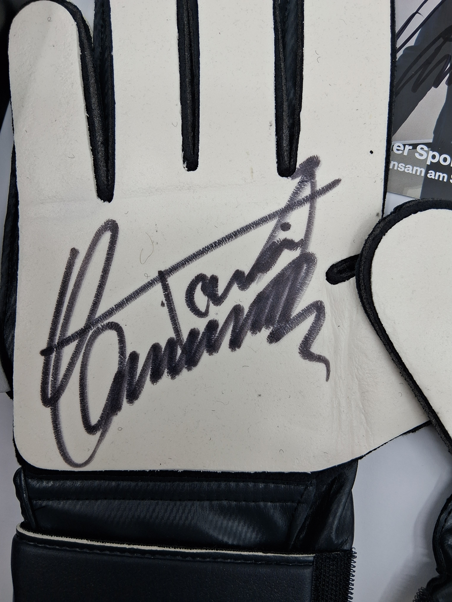 Goalkeeper glove signed by Toni Schumacher in a frame, autographed football