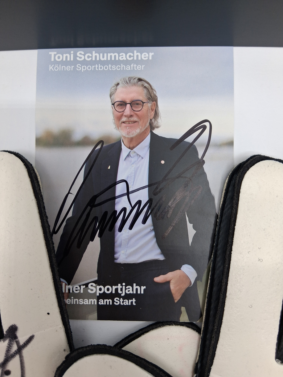 Goalkeeper glove signed by Toni Schumacher in a frame, autographed football