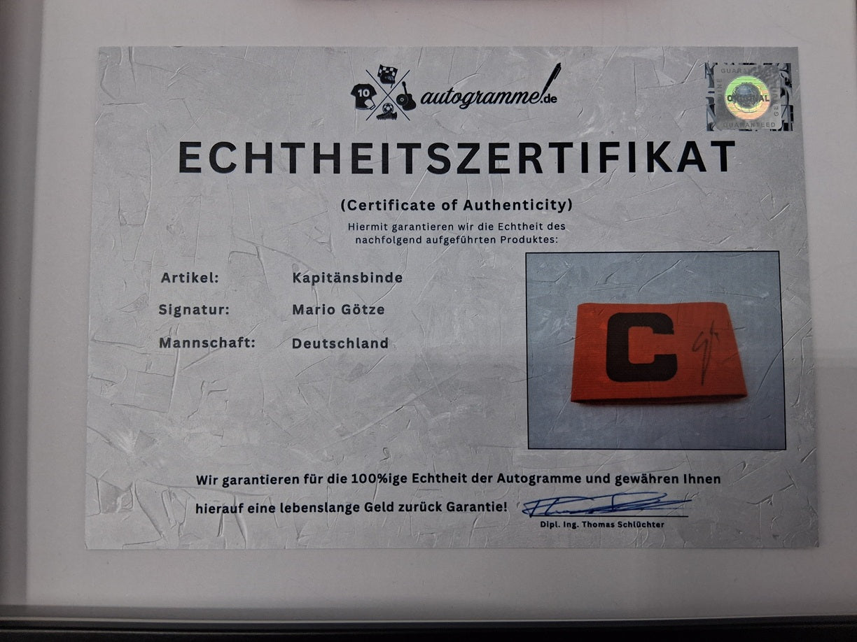 Captain's armband signed by Mario Götze in a frame for DFB Germany World Champion