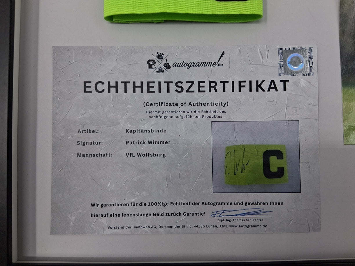 Captain's armband signed by Patrick Wimmer in a VFL Wolfsburg autograph COA frame