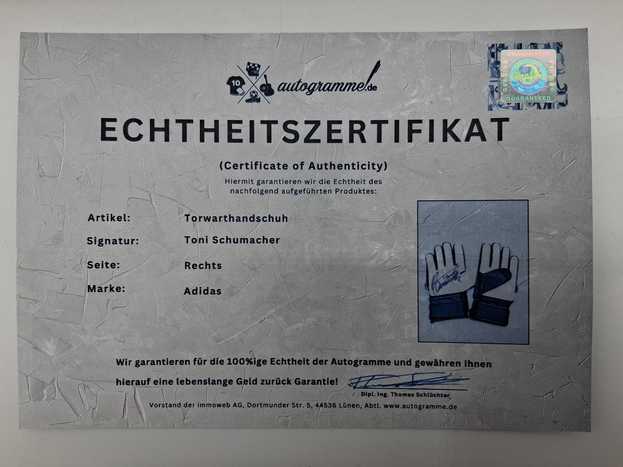 Goalkeeper glove signed by Toni Schumacher in a frame, autographed football