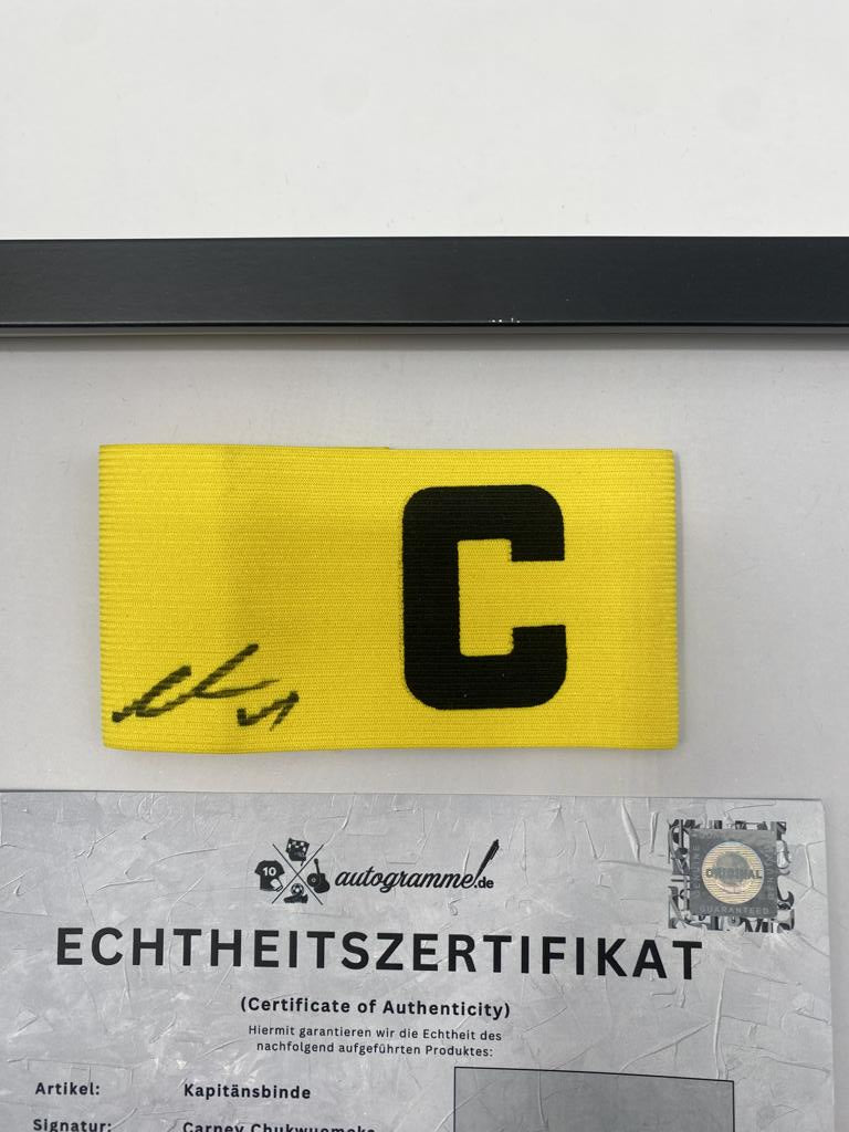 Captain's armband signed by Carney Chukwuemeka in a Borussia Dortmund autograph frame