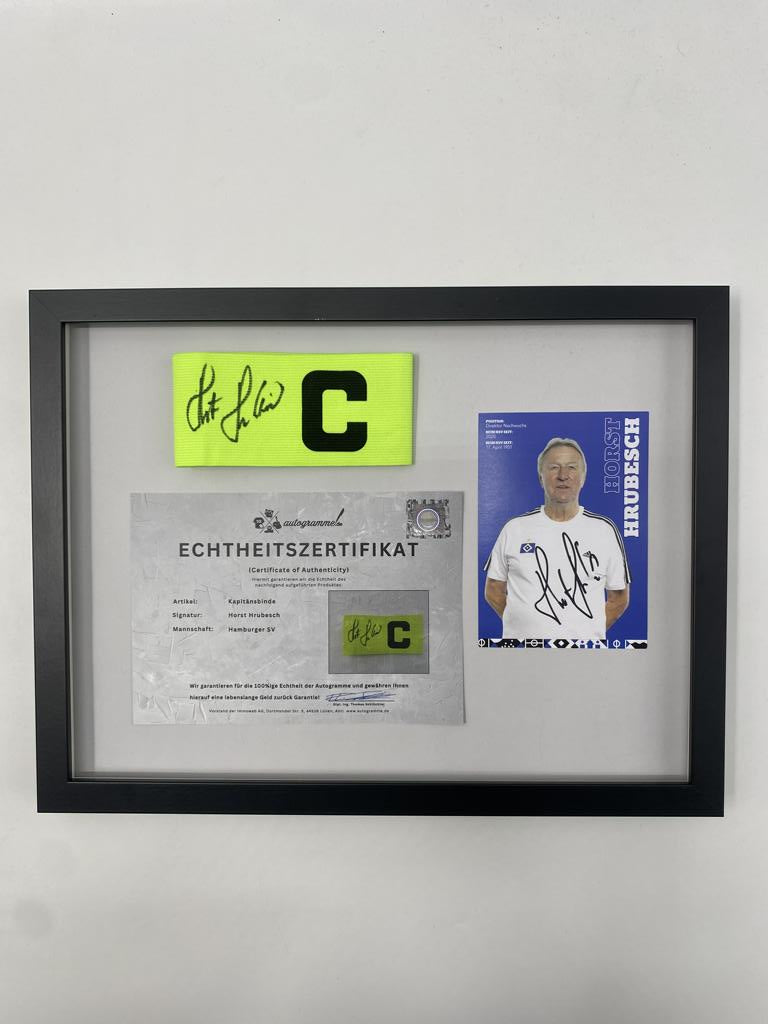 Brazalete de capitán firmado por Horst Hrubesch en un marco, autógrafo COA del Hamburger SV