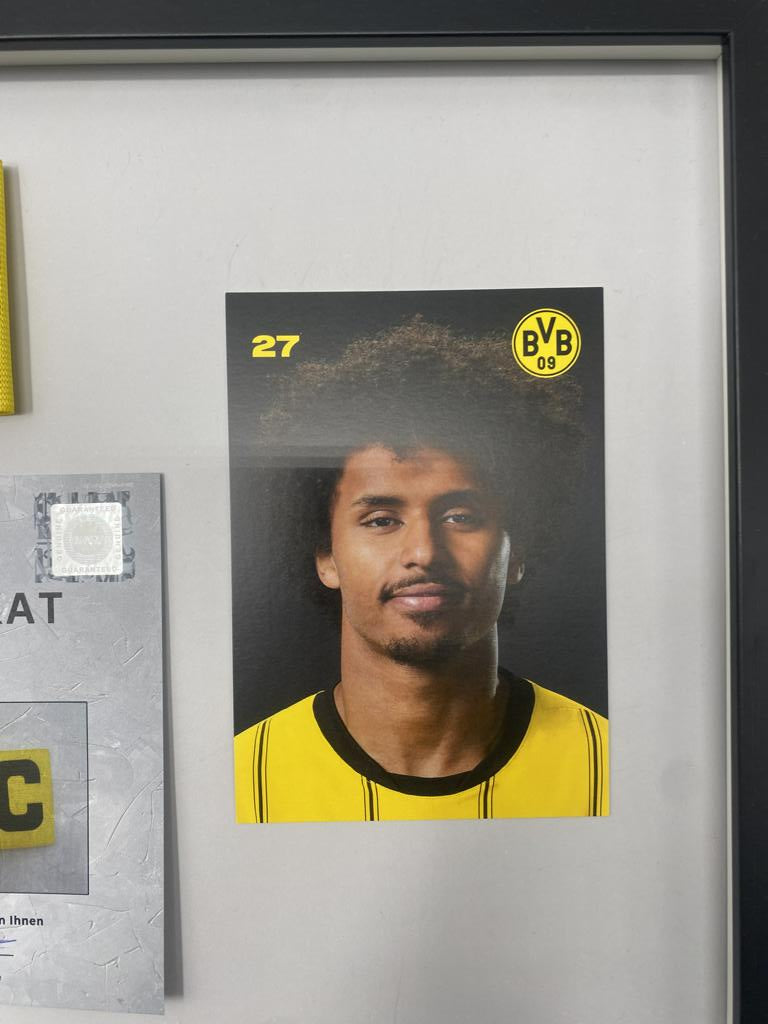 Captain's armband signed by Karim Adeyemi in a Borussia Dortmund autograph COA frame