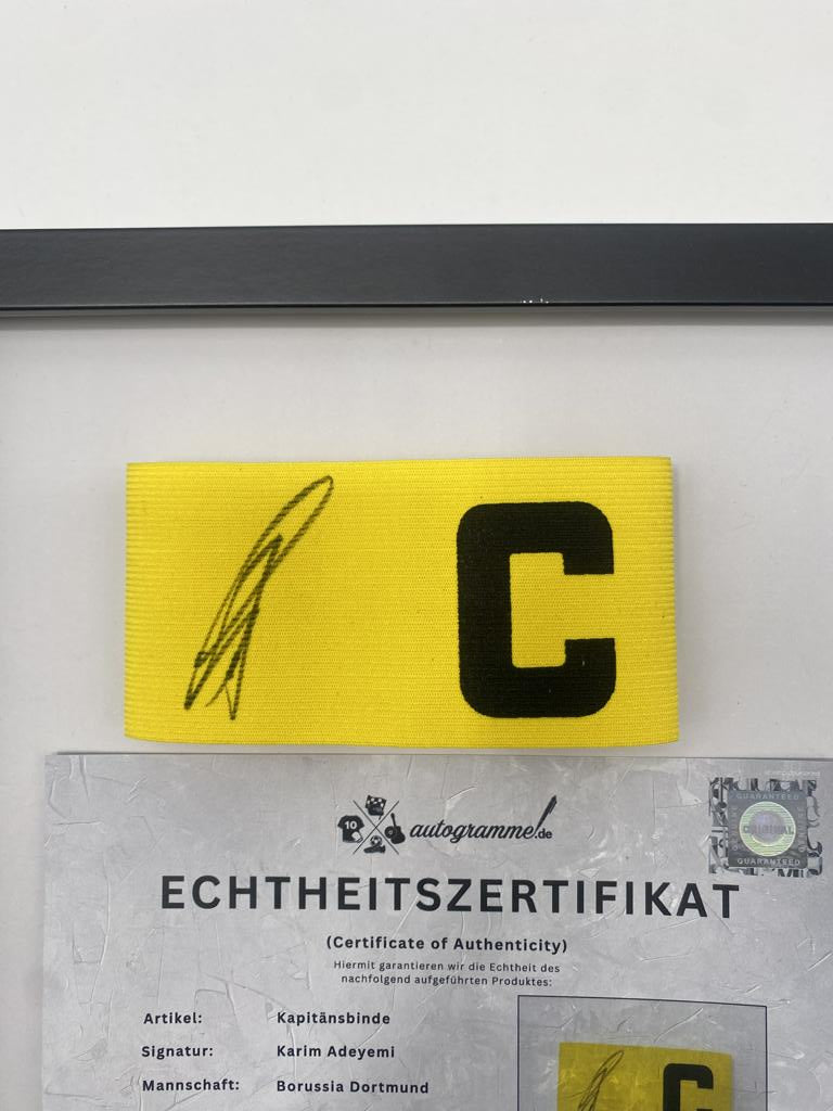Captain's armband signed by Karim Adeyemi in a Borussia Dortmund autograph COA frame