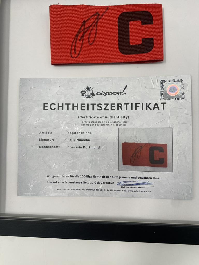 Captain's armband signed by Felix Nmecha as part of the Borussia Dortmund COA