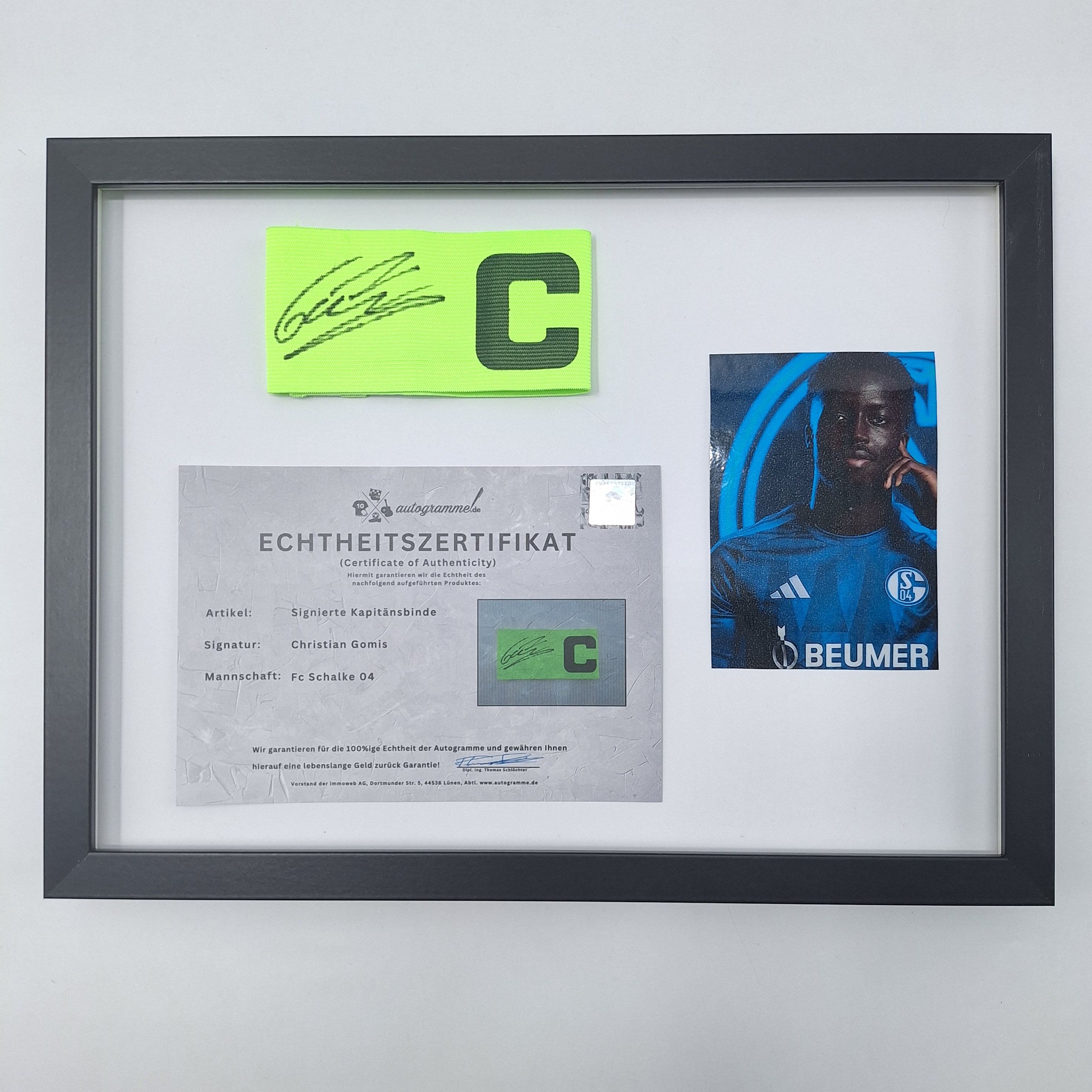 Kapitänsbinde Christian Gomis signiert im Rahmen Schalke 04 COA grün