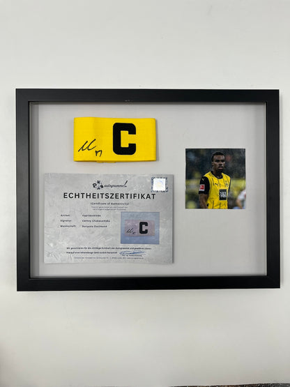 Captain's armband signed by Carney Chukwuemeka in a Borussia Dortmund COA frame