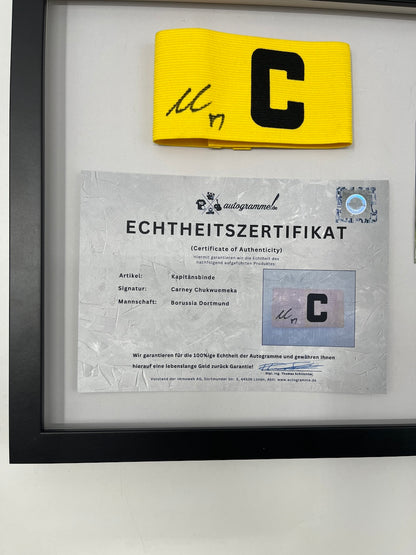 Captain's armband signed by Carney Chukwuemeka in a Borussia Dortmund COA frame
