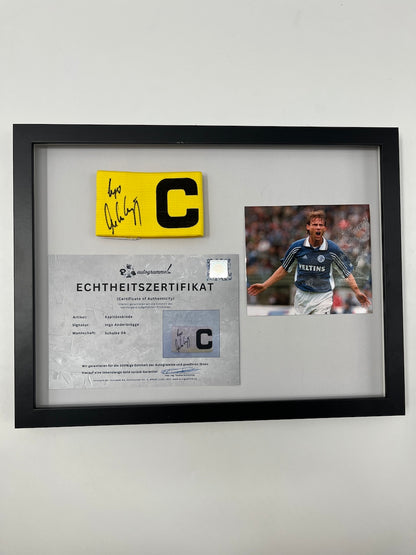 Captain's armband signed by Ingo Anderbrügge in a Schalke 04 COA frame