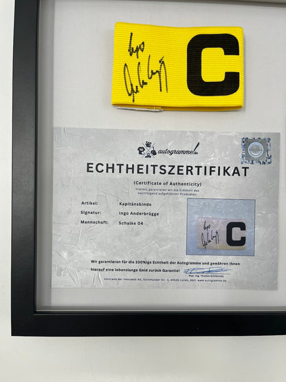Captain's armband signed by Ingo Anderbrügge in a Schalke 04 COA frame