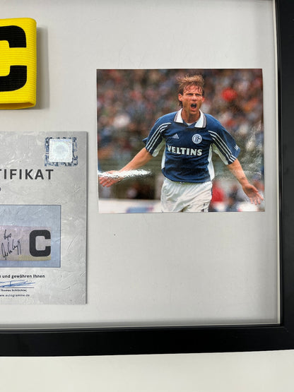 Captain's armband signed by Ingo Anderbrügge in a Schalke 04 COA frame