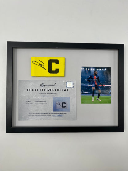 Captain's armband signed by Ousmane Dembele in a PSG COA frame