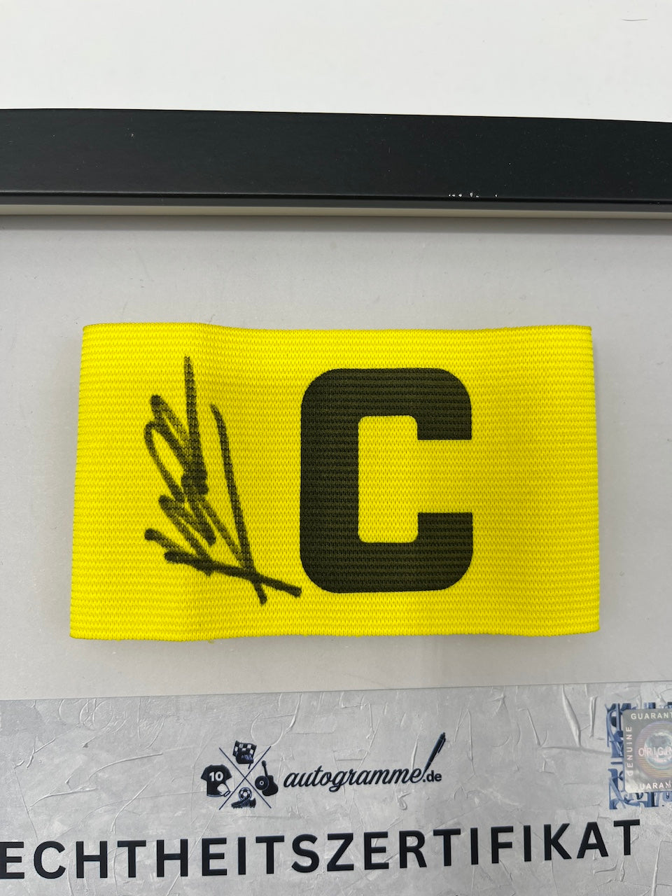 Captain's armband signed by Nuno Mendes in the PSG COA frame