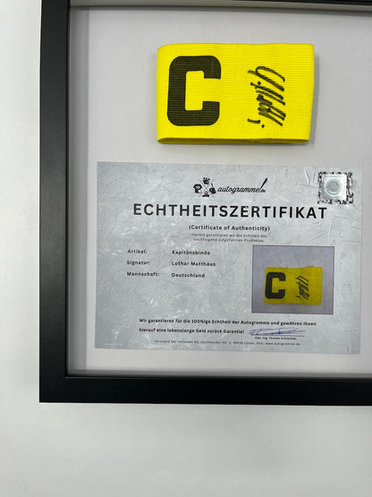 Captain's armband signed by Lothar Matthäus in a frame Germany COA