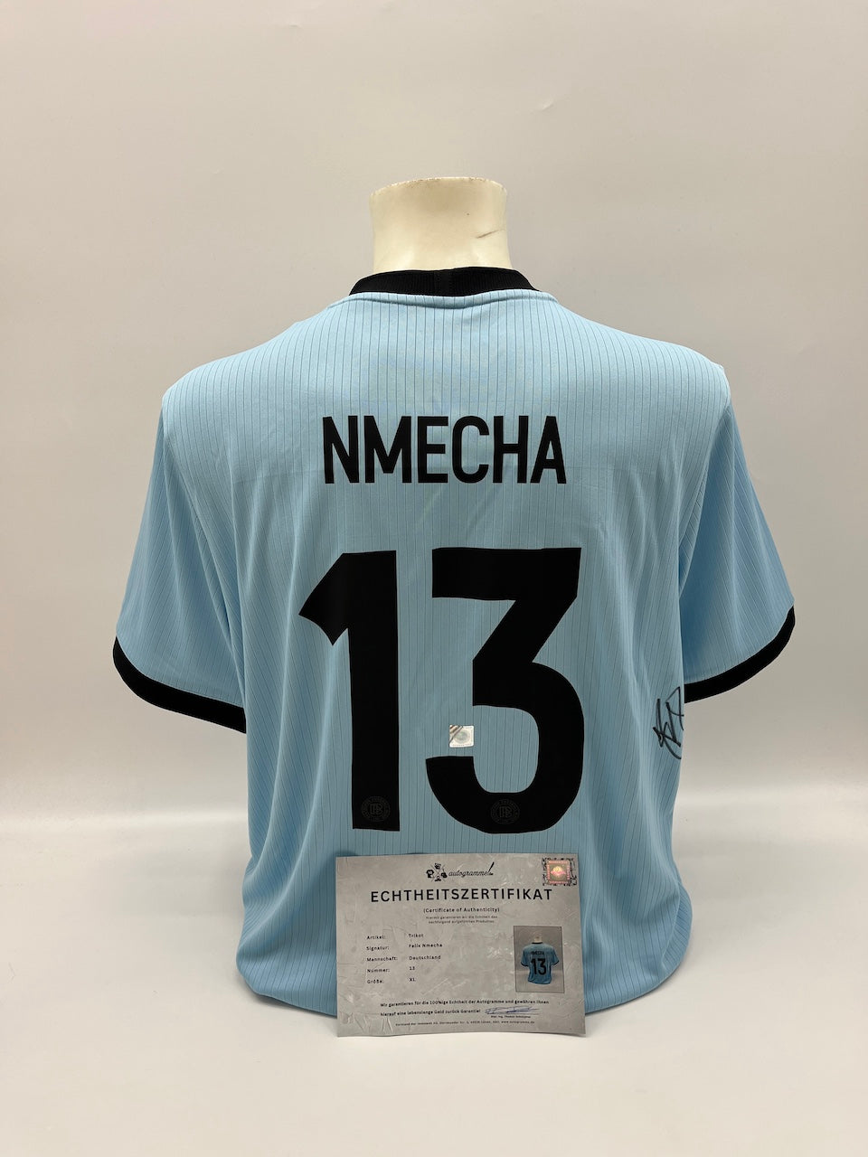 Camiseta de la DFB firmada por Félix Nmecha, con certificado de autenticidad de Adidas, talla XL.