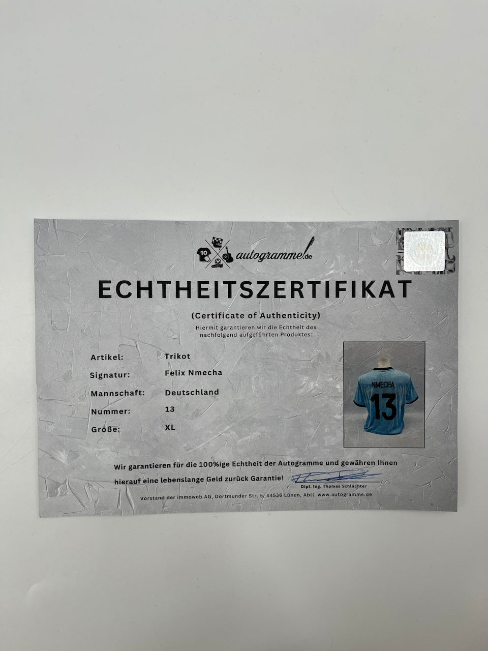 Camiseta de la DFB firmada por Félix Nmecha, con certificado de autenticidad de Adidas, talla XL.